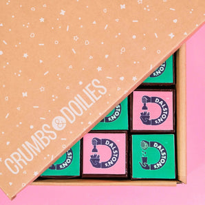 Corporate Brownies with Edible Logos in a Crumbs & Doilies branded box, featuring custom Dalston's logo toppers.